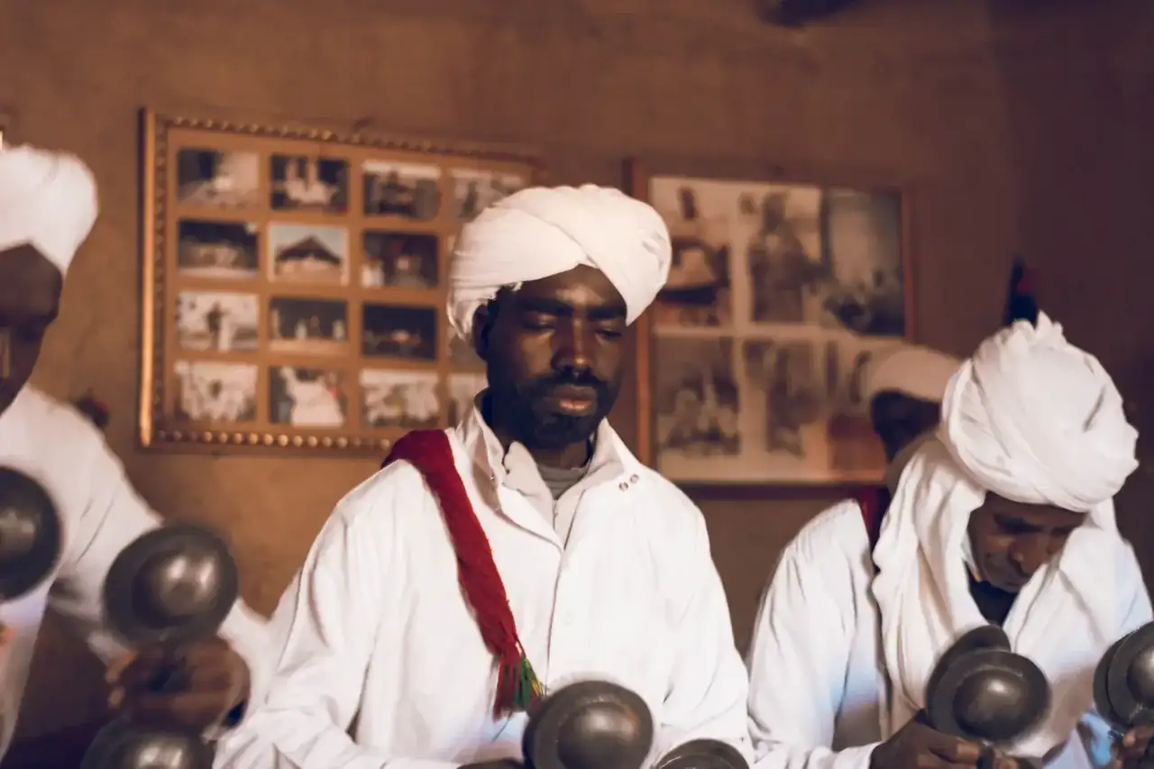 Gnawa musicians playing qraqeb in Khamlia village
